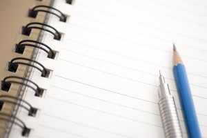 blank notepad paper and pencil